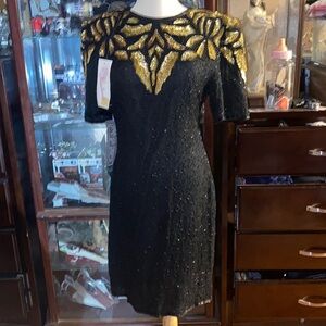 Patchouli vintage party dress size Medium with gold árquense and black spangles